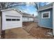Detached garage and backyard with a stone pathway at 4360 Guilford Ave, Indianapolis, IN 46205