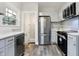 Updated kitchen featuring stainless steel appliances and white shaker cabinets at 4360 Guilford Ave, Indianapolis, IN 46205