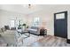 Modern living room with gray sofa and wooden coffee table at 4360 Guilford Ave, Indianapolis, IN 46205