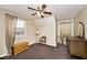 Bright bedroom featuring a ceiling fan and ample closet space at 11197 N Gasburg Rd, Mooresville, IN 46158