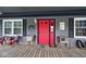 Red front door with patriotic decorations on a gray house at 11197 N Gasburg Rd, Mooresville, IN 46158