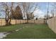 Spacious backyard with a wooden fence and a paved pathway at 1127 E Kelly St, Indianapolis, IN 46203