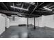 Unfinished basement with high ceilings and freshly painted white walls at 1127 E Kelly St, Indianapolis, IN 46203