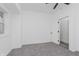 Bright bedroom with grey carpet and an open door to another room at 1127 E Kelly St, Indianapolis, IN 46203