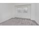 Bright bedroom with grey carpet and large window at 1127 E Kelly St, Indianapolis, IN 46203