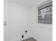 Bright laundry room with vinyl flooring and a window at 1127 E Kelly St, Indianapolis, IN 46203