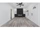 Updated living room with a stylish fireplace and gray vinyl flooring at 1127 E Kelly St, Indianapolis, IN 46203