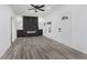 Modern living room with a dark fireplace accent wall and gray flooring at 1127 E Kelly St, Indianapolis, IN 46203