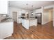 Kitchen with white cabinets, granite countertops, and island at 11323 Long Sotton Ln, Fishers, IN 46037