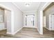 Bright entryway with light gray walls and wood-look flooring at 11463 Long Sotton Ln, Fishers, IN 46037