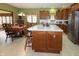 Eat-in kitchen with large island, stainless steel appliances, and wood cabinets at 116 Augusta Dr, Brownsburg, IN 46112