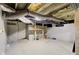 Unfinished basement with exposed utilities and workbench at 133 N East St, Greenfield, IN 46140