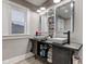 Bathroom with dual vanities, modern fixtures and dark wood cabinetry at 133 N East St, Greenfield, IN 46140