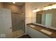 Bathroom with double vanity, large mirror and shower at 16892 Cattle Hollow Ln, Noblesville, IN 46060