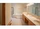 Bathroom with a corner jacuzzi tub, double vanity, and gold fixtures at 1865 Inisheer Ct, Indianapolis, IN 46217