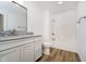 Bathroom with granite vanity and a shower/tub combo at 202 Asbury Dr, Anderson, IN 46013