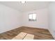 Well-lit bedroom featuring wood-look flooring at 202 Asbury Dr, Anderson, IN 46013