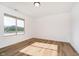 Spacious bedroom with large window and light wood flooring at 202 Asbury Dr, Anderson, IN 46013