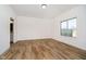 Spacious bedroom with hardwood floors and access to bathroom at 202 Asbury Dr, Anderson, IN 46013