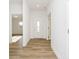 Bright entryway with light wood flooring and neutral walls at 202 Asbury Dr, Anderson, IN 46013