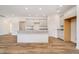 Modern kitchen with island, stainless steel appliances, and light gray cabinets at 202 Asbury Dr, Anderson, IN 46013