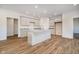 Modern kitchen with island, stainless steel appliances, and light gray cabinets at 202 Asbury Dr, Anderson, IN 46013