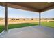 Covered patio overlooking a grassy backyard and neighboring homes at 202 Asbury Dr, Anderson, IN 46013