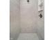 Clean and modern walk-in shower with marble tile at 202 Asbury Dr, Anderson, IN 46013