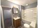 Clean bathroom with tub, shower, and wood vanity at 2205 Main St, Anderson, IN 46016