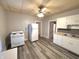 Kitchen with white appliances and vinyl flooring at 2205 Main St, Anderson, IN 46016