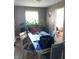 Casual dining area with table and chairs, adjacent to living room at 2307 N Catherwood Ave, Indianapolis, IN 46219