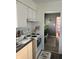 Efficient kitchen with white cabinets and electric range at 2307 N Catherwood Ave, Indianapolis, IN 46219