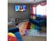 Relaxing living room with blue sofa and colorful rug at 2307 N Catherwood Ave, Indianapolis, IN 46219