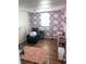 Home office with pink and gray diamond pattern walls at 2307 N Catherwood Ave, Indianapolis, IN 46219
