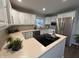 Modern kitchen with white cabinets and stainless steel appliances at 2339 Jolinda Ct, Columbus, IN 47203