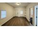 Bright bedroom with hardwood floors and exterior access at 2342 Hoyt Ave, Indianapolis, IN 46203