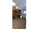 Kitchen area with wood cabinets, laminate floors, and a window at 240 S Marion St, Martinsville, IN 46151