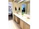 Double vanity bathroom with large mirror and tile floor at 316 Northpointe Ct, Danville, IN 46122