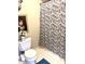 Charming bathroom with shower, floral shower curtain, and decorative accents at 316 Northpointe Ct, Danville, IN 46122