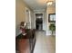 Bright entryway with tile floor, view to dining area, and dark wood console table at 316 Northpointe Ct, Danville, IN 46122