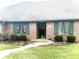 Brick ranch home with green shutters, landscaping, and a walkway at 316 Northpointe Ct, Danville, IN 46122