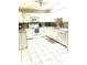 Bright kitchen with white cabinets, tile floor, and modern appliances at 316 Northpointe Ct, Danville, IN 46122