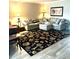 Spacious living room with sectional sofa and large area rug at 316 Northpointe Ct, Danville, IN 46122