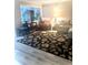 Living room featuring hardwood floors and comfy seating at 316 Northpointe Ct, Danville, IN 46122