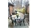 Small patio with bistro set and landscaping, offering a peaceful outdoor space at 316 Northpointe Ct, Danville, IN 46122