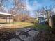 Backyard with shed, wooden fence, and patio at 3931 N Faculty Dr, Indianapolis, IN 46254