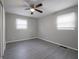 Spacious bedroom with ceiling fan and gray walls at 3931 N Faculty Dr, Indianapolis, IN 46254