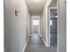 Clean hallway with gray walls and vinyl flooring at 3931 N Faculty Dr, Indianapolis, IN 46254