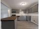 Modern kitchen with gray cabinets, stainless steel appliances and granite countertops at 3931 N Faculty Dr, Indianapolis, IN 46254