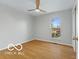 Well-lit bedroom with hardwood floors and a window view at 4151 Senour Rd, Indianapolis, IN 46239